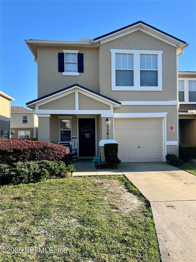 1500 Calming Water Dr Unit 5501, Fleming Island, FL 32003 - traditional-style house with a garage, driveway, and stucco siding