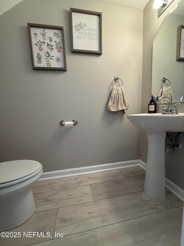1500 Calming Water Dr Unit 5501, Fleming Island, FL 32003 - half bath featuring toilet and baseboards