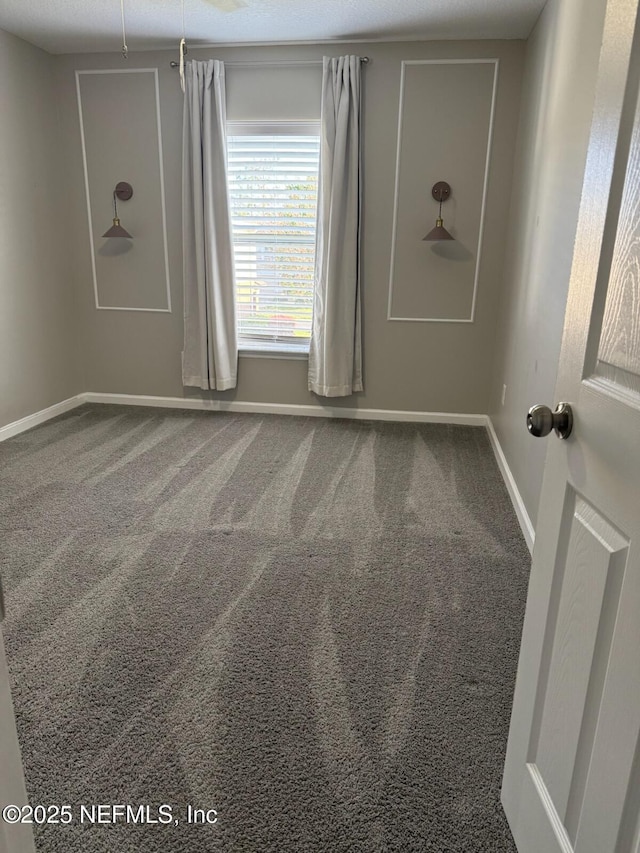 1500 Calming Water Dr Unit 5501, Fleming Island, FL 32003 - carpeted spare room featuring baseboards