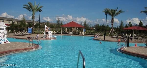 1500 Calming Water Dr Unit 5501, Fleming Island, FL 32003 - community pool featuring a patio and a gazebo