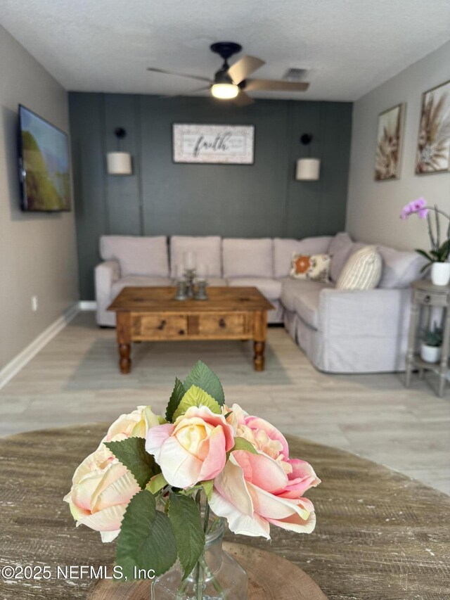 1500 Calming Water Dr Unit 5501, Fleming Island, FL 32003 - living area featuring baseboards and ceiling fan