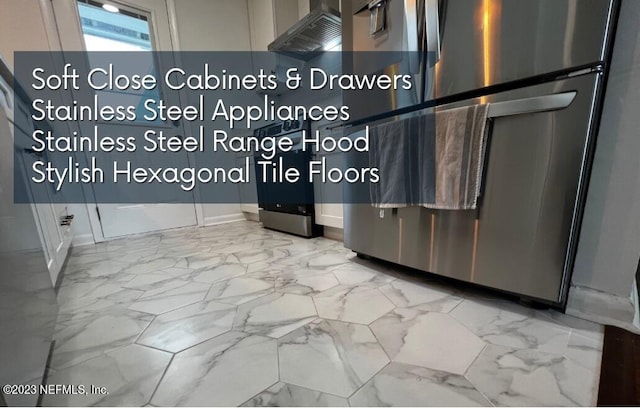 451 Whiting Ln, Atlantic Beach, FL 32233 - kitchen featuring baseboards, marble finish floor, and refrigerator