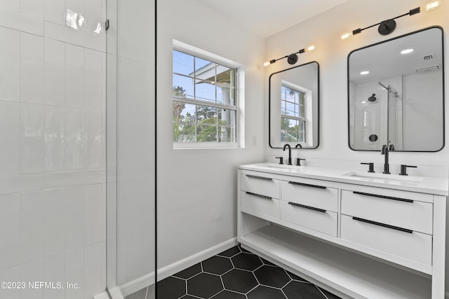 451 Whiting Ln, Atlantic Beach, FL 32233 - bathroom featuring tile patterned floors, a sink, a shower stall, and double vanity