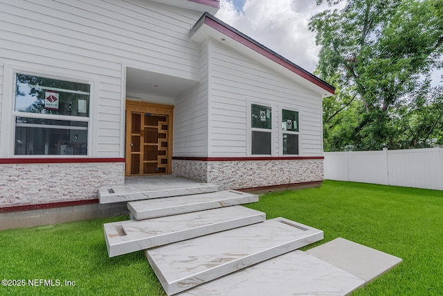 4649 Shelby Ave, Jacksonville, FL 32210 - view of exterior entry featuring stone siding