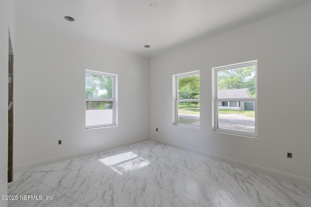 4649 Shelby Ave, Jacksonville, FL 32210 - empty room featuring marble look tiles and baseboards