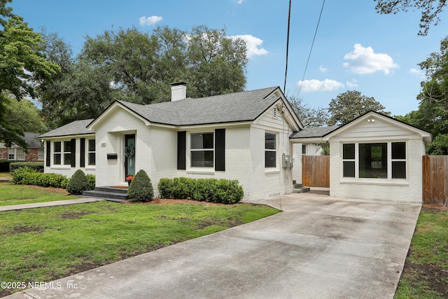 1407 Palmer Ter, Jacksonville, FL 32207 - single story home with brick siding, driveway, a chimney, and a shingled roof