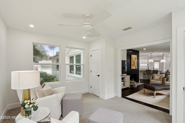 1407 Palmer Ter, Jacksonville, FL 32207 - living area featuring healthy amount of natural light, carpet flooring, a ceiling fan, baseboards, and recessed lighting