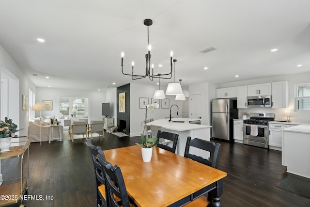 1407 Palmer Ter, Jacksonville, FL 32207 - dining area with plenty of natural light, recessed lighting, a chandelier, and dark wood finished floors