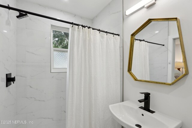 1407 Palmer Ter, Jacksonville, FL 32207 - bathroom with a sink and a shower with shower curtain