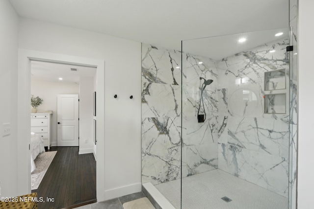1407 Palmer Ter, Jacksonville, FL 32207 - bathroom with a marble finish shower, wood finished floors, recessed lighting, vanity, and baseboards