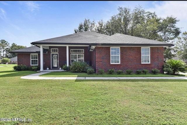 6128 Copper Ridge Cir, Macclenny, FL 32063 - single story home featuring brick siding, a shingled roof, and a front lawn