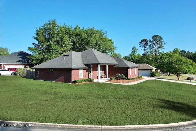 6128 Copper Ridge Cir, Macclenny, FL 32063 - view of front facade featuring a detached garage and a front lawn