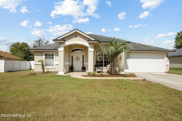 ranch-style home with stucco siding, fence, a front yard, concrete driveway, and an attached garage