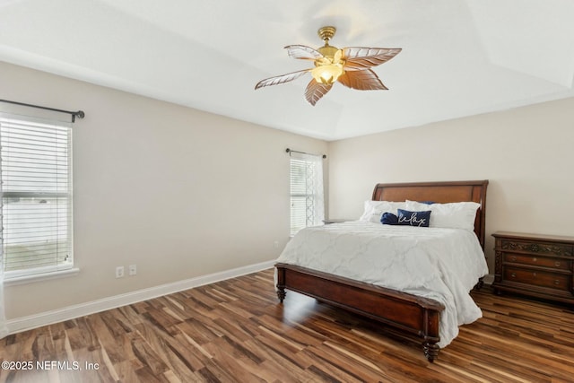 bedroom featuring wood finished floors, ceiling fan, and baseboards