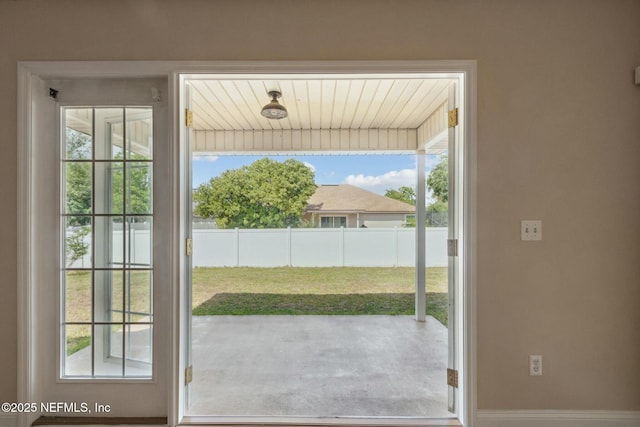 entryway with baseboards and plenty of natural light