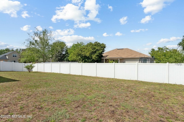 view of yard with fence