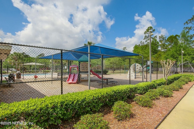 community playground featuring fence