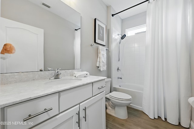 291 Greenway Ln, Saint Augustine, FL 32092 - full bathroom with visible vents, vanity, wood finished floors, toilet, and shower / bathtub combination with curtain