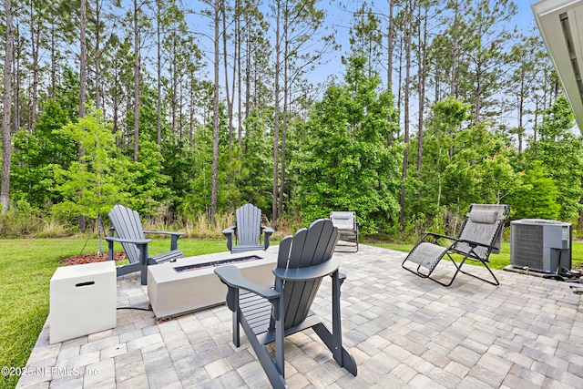 291 Greenway Ln, Saint Augustine, FL 32092 - view of patio / terrace featuring central AC unit and an outdoor fire pit