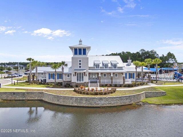 291 Greenway Ln, Saint Augustine, FL 32092 - back of house featuring a water view, a chimney, a standing seam roof, and metal roof