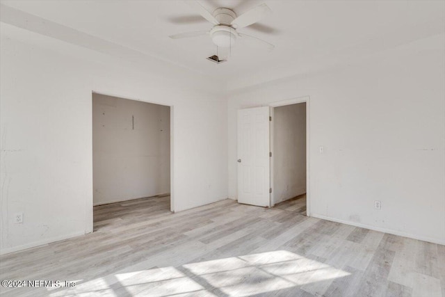unfurnished bedroom featuring a ceiling fan and light wood finished floors