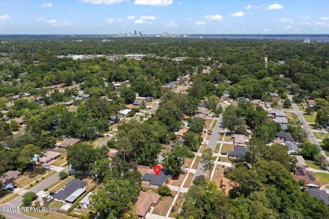 bird's eye view featuring a forest view and a residential view