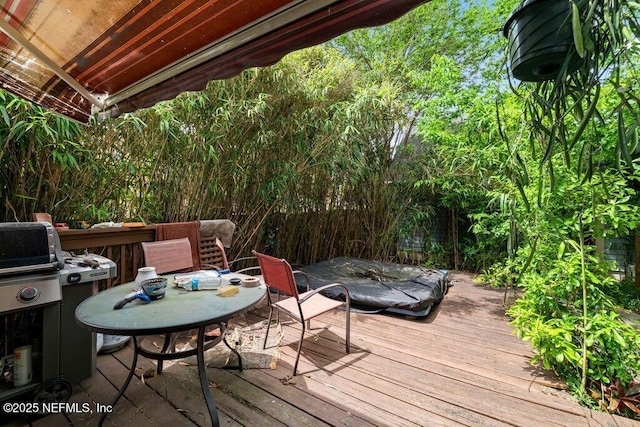 deck featuring outdoor dining area