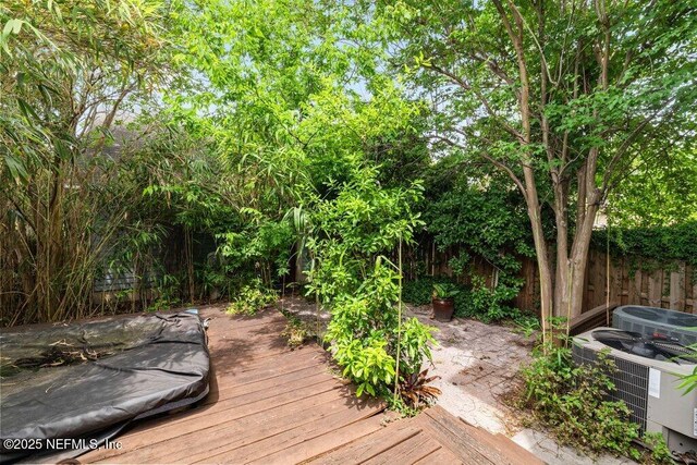 deck with central AC and fence