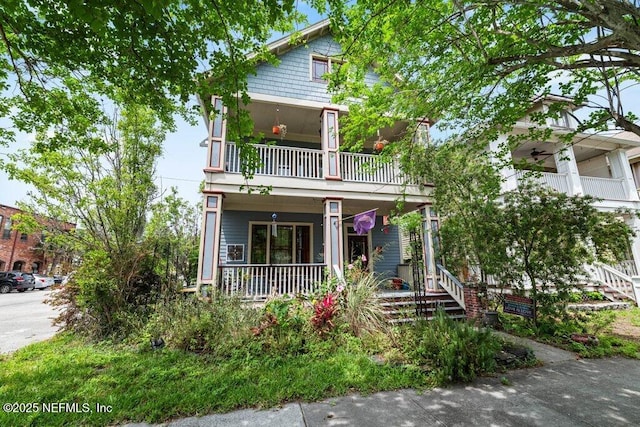 view of front of home with a porch and a balcony
