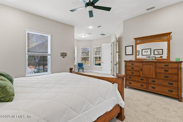 bedroom with ceiling fan, carpet flooring, and visible vents