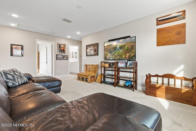 living room with baseboards, carpet, recessed lighting, and a textured ceiling