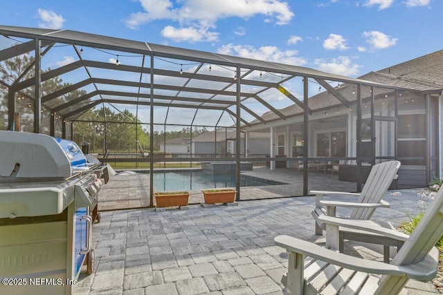 view of patio with a lanai, area for grilling, and an outdoor pool