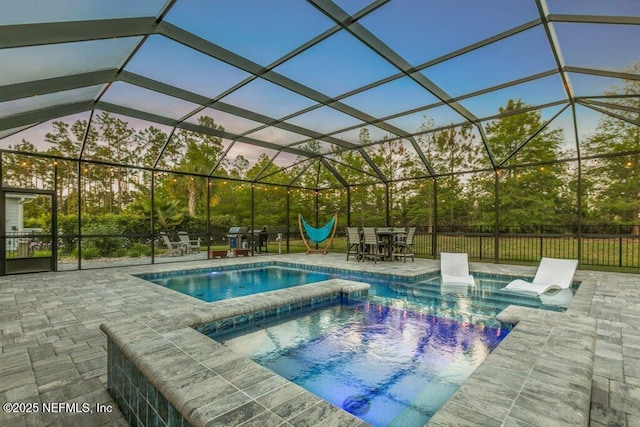 view of swimming pool with a patio area, a pool with connected hot tub, and outdoor dining space