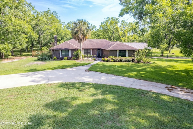 ranch-style house with a front yard