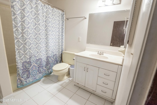 bathroom with vanity, toilet, and tile patterned flooring