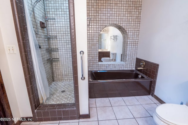 full bath with toilet, a bath, a shower stall, and tile patterned floors