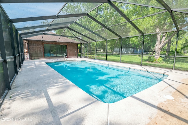 pool featuring a lanai and a patio area