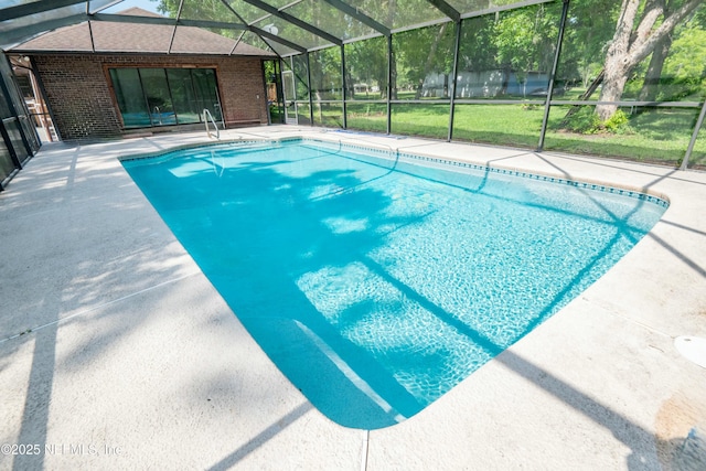 outdoor pool featuring a lanai and a patio area