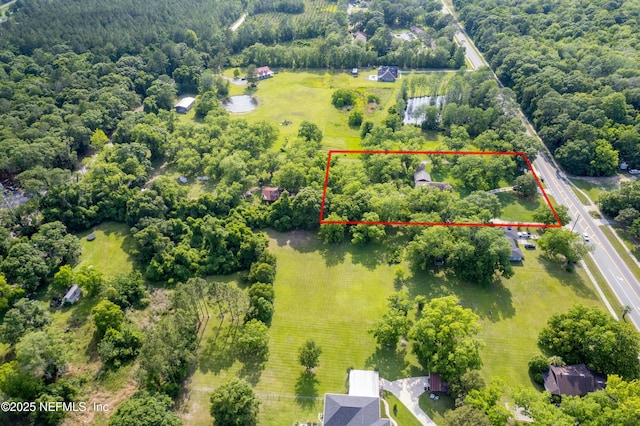 birds eye view of property featuring a rural view