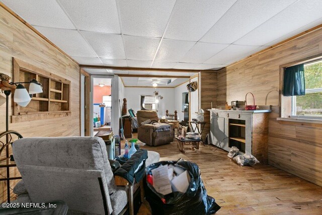 670 Hillsborough Ave, Florahome, FL 32140 - misc room with wood walls, wood finished floors, ceiling fan, and a paneled ceiling