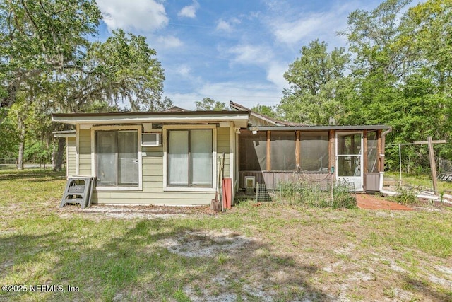 670 Hillsborough Ave, Florahome, FL 32140 - rear view of house with a yard and a sunroom