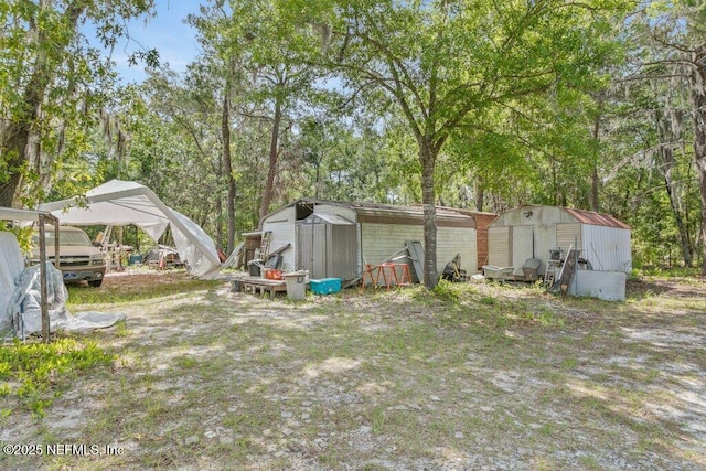 670 Hillsborough Ave, Florahome, FL 32140 - view of yard with an outdoor structure and a storage shed