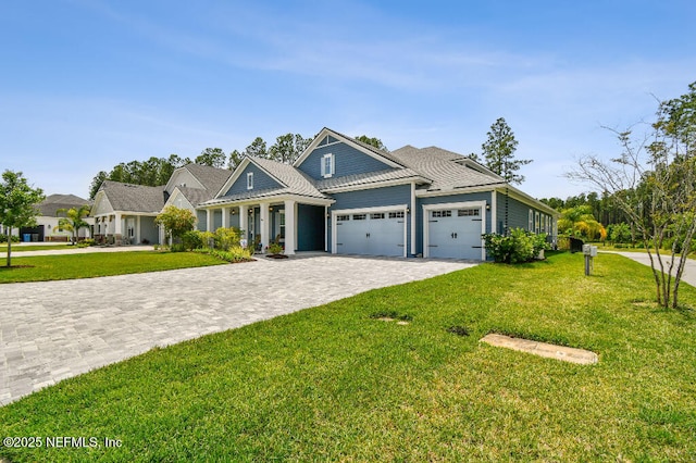 225 Shinnecock Dr, Saint Johns, FL 32259 - craftsman inspired home featuring an attached garage, decorative driveway, and a front yard