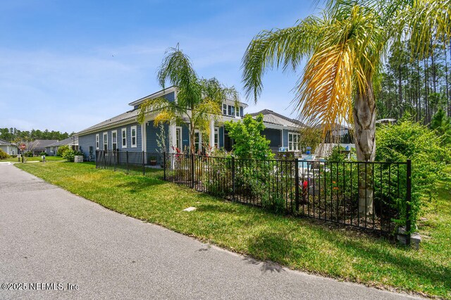 225 Shinnecock Dr, Saint Johns, FL 32259 - view of front of home featuring a front lawn and fence