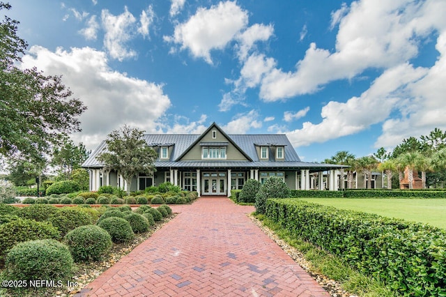 225 Shinnecock Dr, Saint Johns, FL 32259 - view of front of home featuring a standing seam roof, metal roof, and french doors