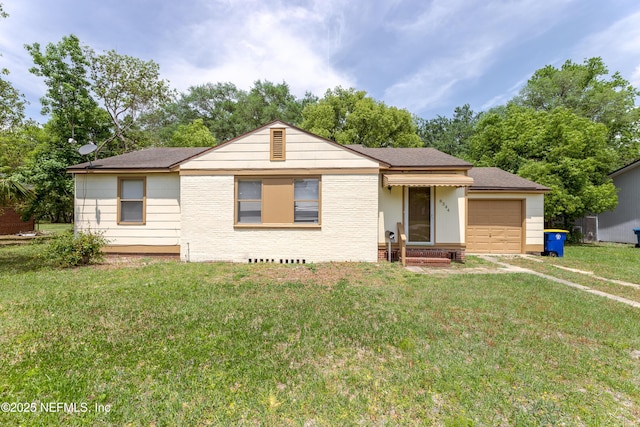 8344 Delaware Ave, Jacksonville, FL 32208 - view of front of home with a shingled roof, brick siding, a front yard, and a garage