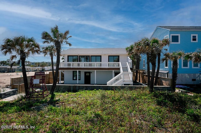 2818 Coastal Hwy, Saint Augustine, FL 32084 - back of house featuring fence and stairway