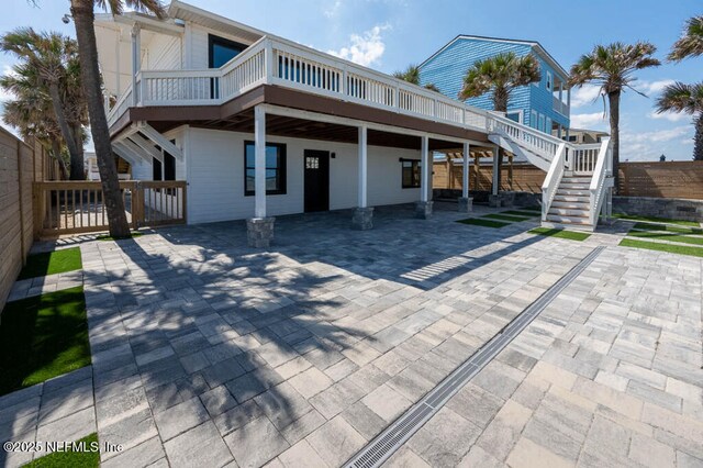 2818 Coastal Hwy, Saint Augustine, FL 32084 - back of house featuring stairway, fence, and a deck