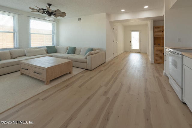 2818 Coastal Hwy, Saint Augustine, FL 32084 - living area featuring ceiling fan, light wood finished floors, a textured ceiling, recessed lighting, and visible vents