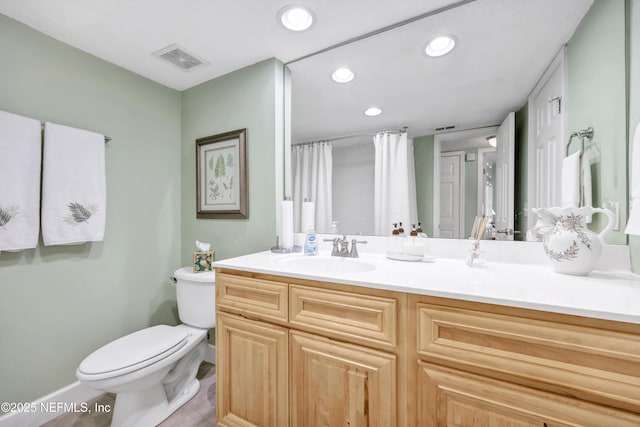 3434 Blanding Blvd Unit 214, Jacksonville, FL 32210 - bathroom with recessed lighting, visible vents, toilet, vanity, and baseboards